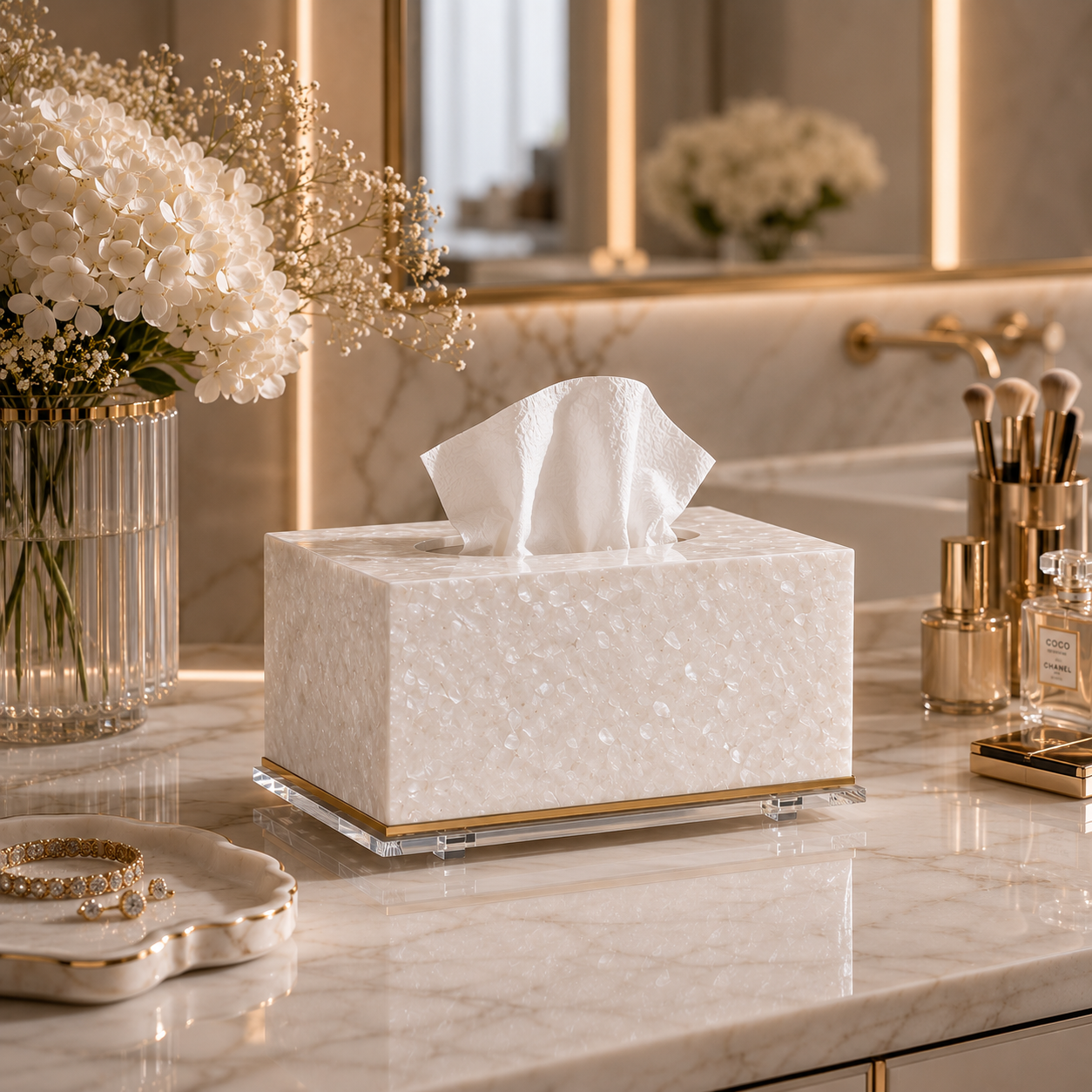 Decorative tissue box on a marble surface with flowers and perfume bottles in the background - Zstander