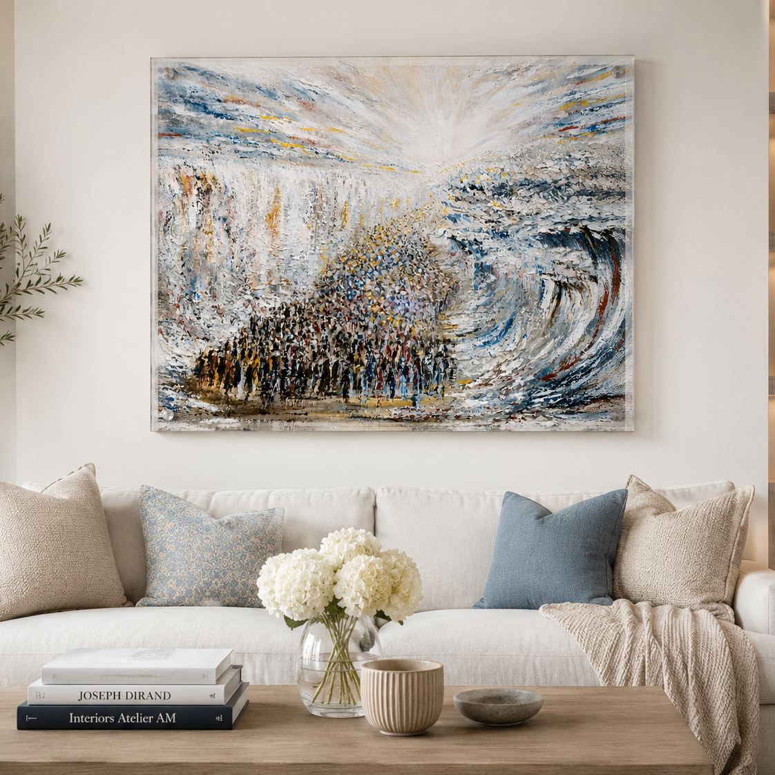 Living room with a large abstract painting above a sofa, books on a coffee table, and decorative elements - Zstander