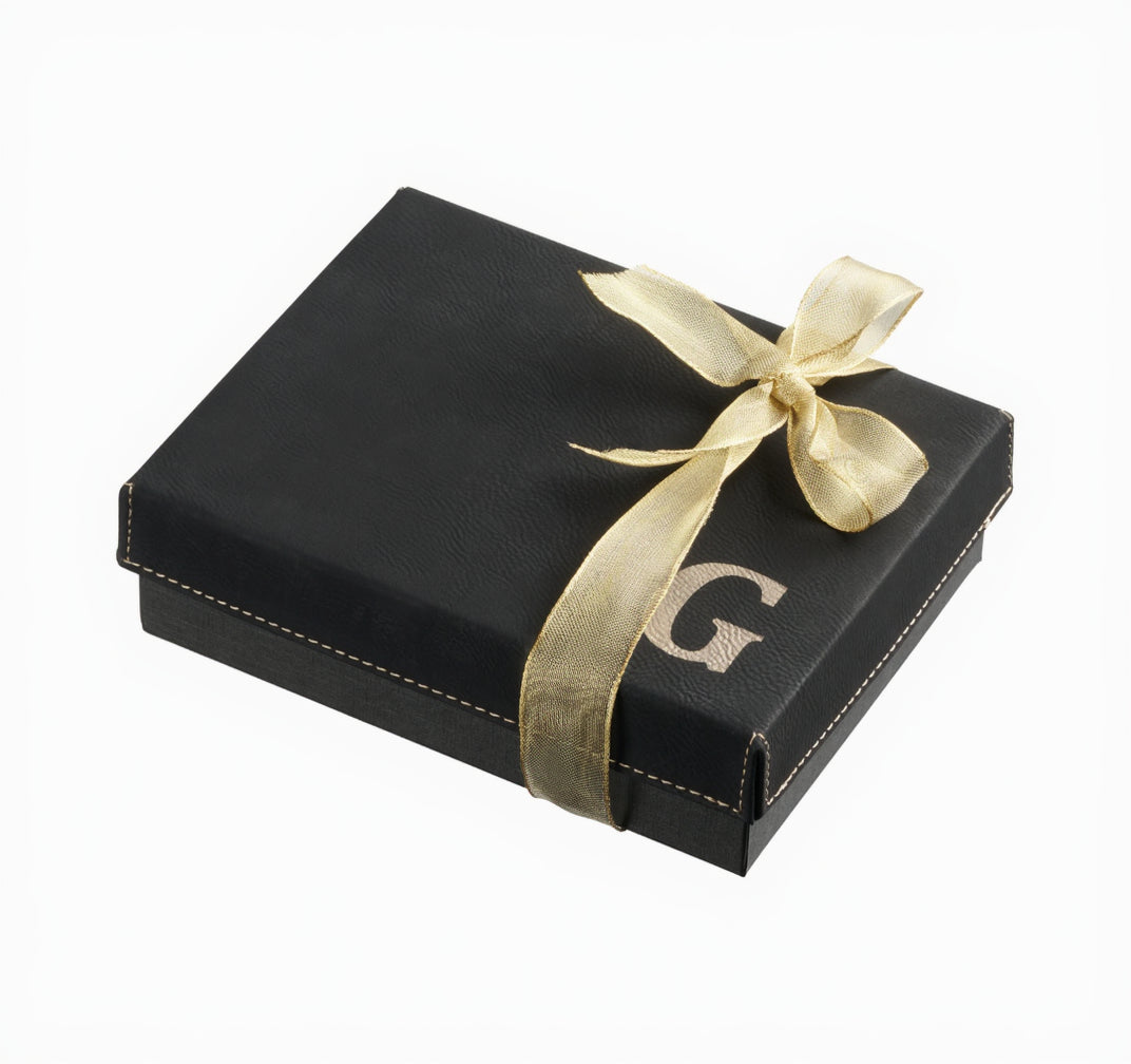 Black leatherette giftbox with a ribbon and monogrammed G on a white background - Zstander