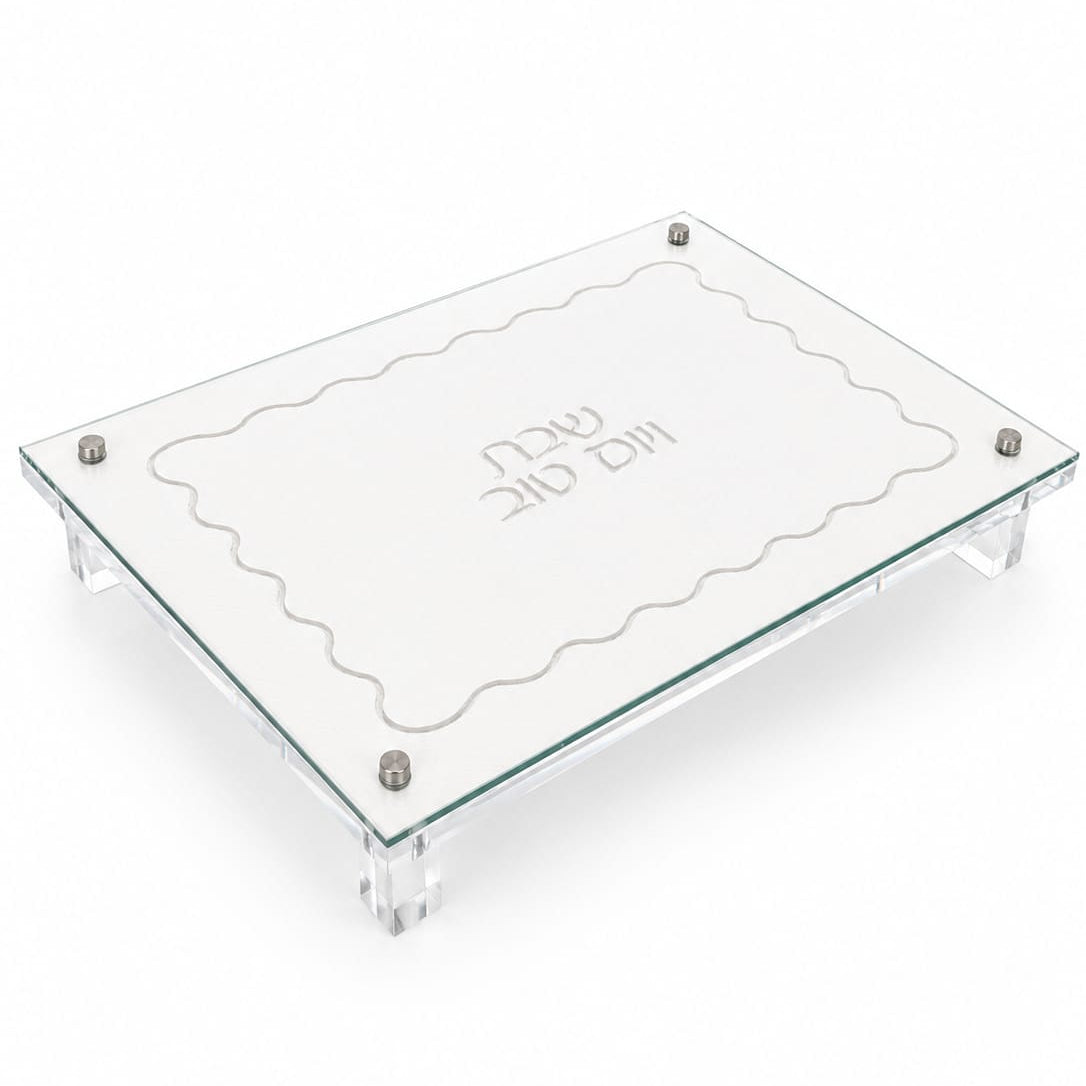 Clear glass and lucite challah board with scalloped edge and engraved text on a white background - Zstander