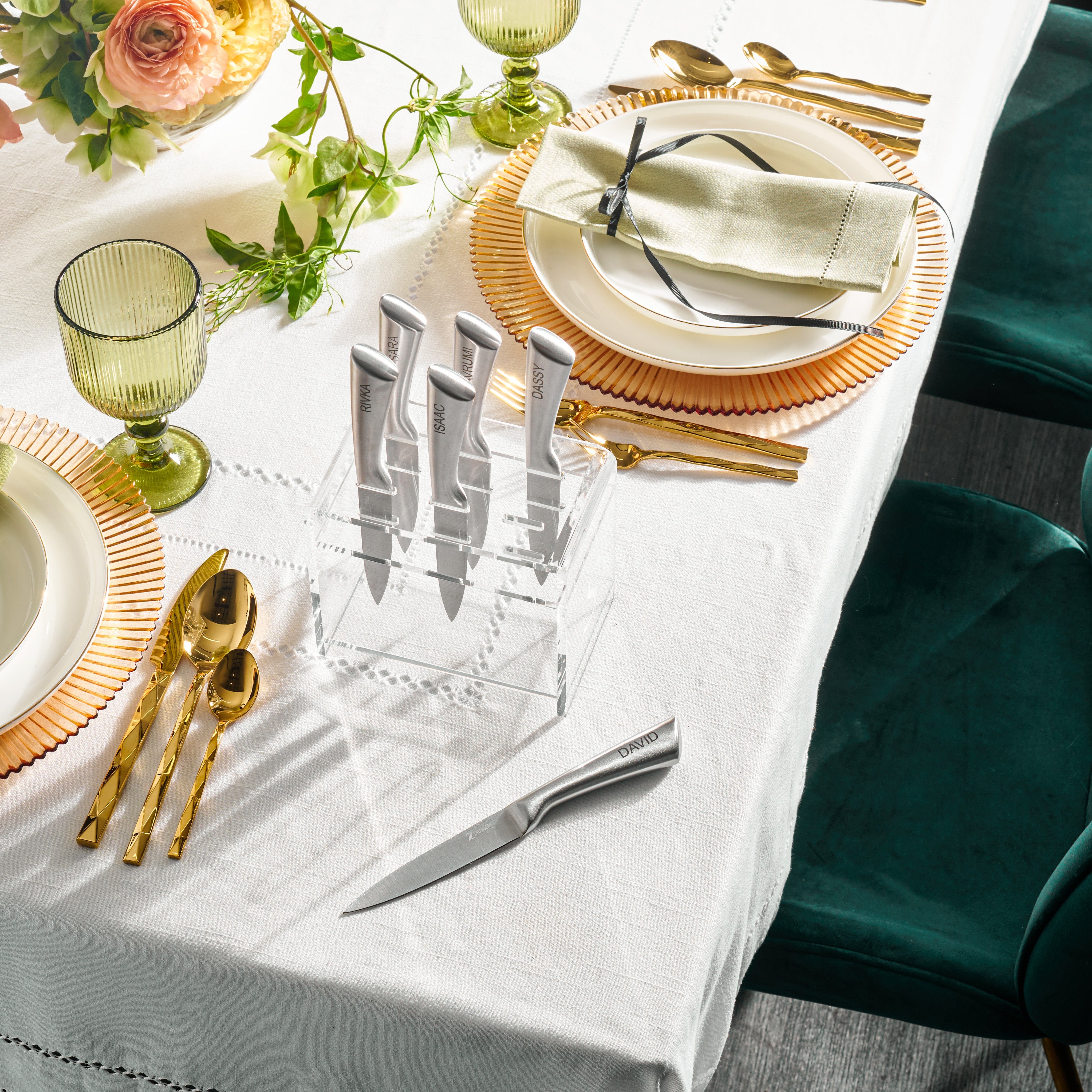 Dining table setting with green chairs, white tablecloth, and decorative elements - Zstander