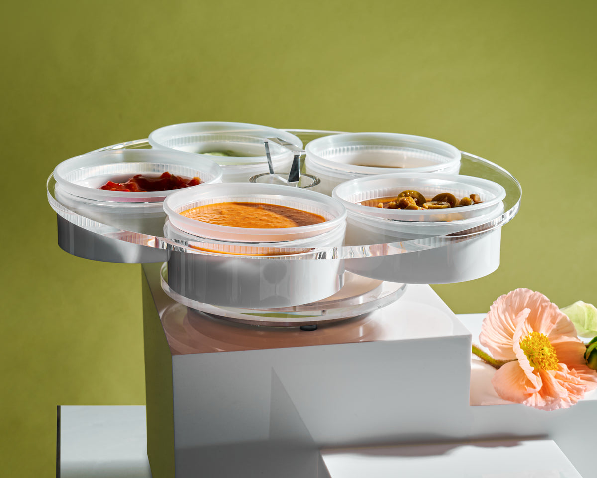 Lazy Suzan round dip tray on pedestals with a green background - Zstander