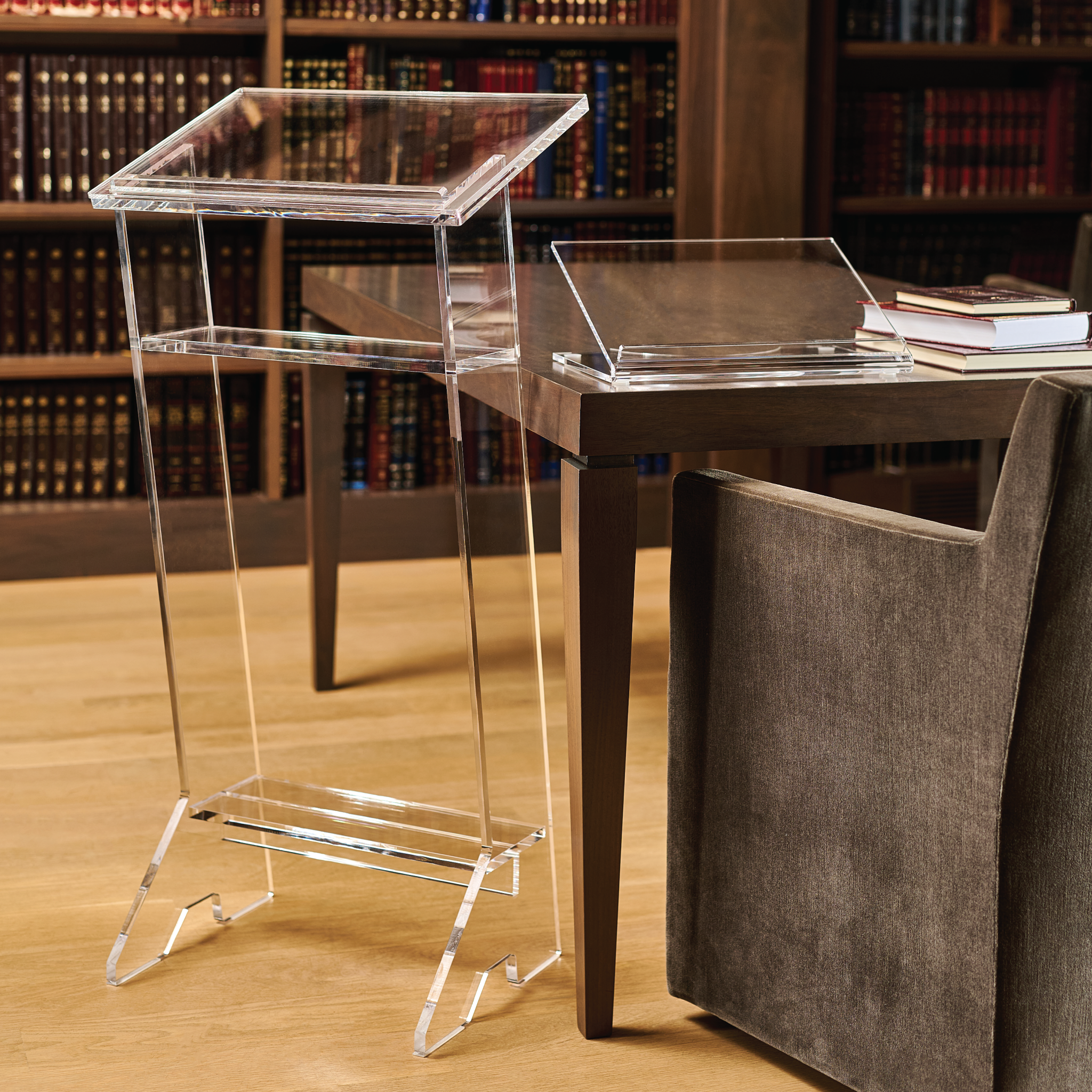 Clear acrylic shtender on a wooden table with books in the background - Zstander