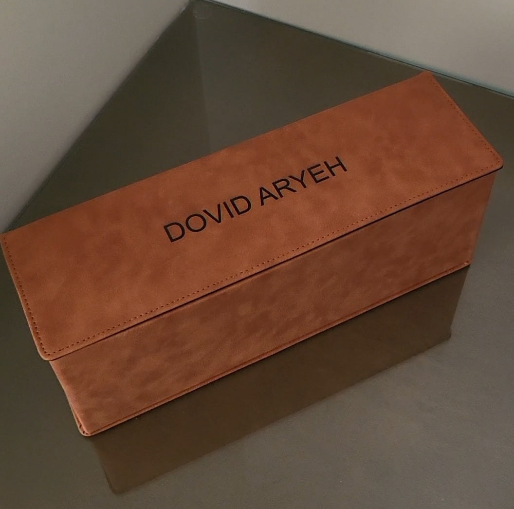 Brown box with engraved Dovid Aryeh on a desk - Zstander