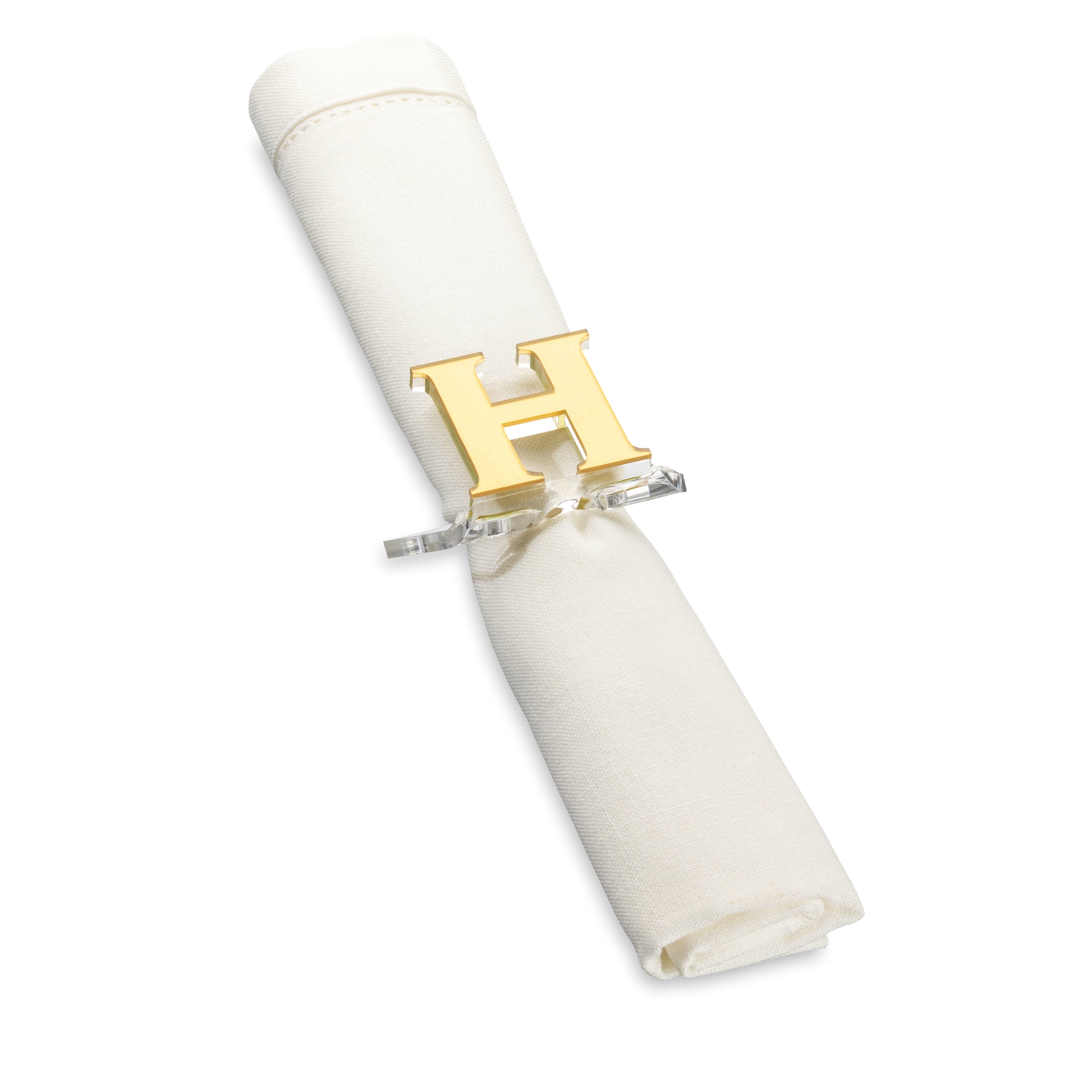 A clear lucite napkin ring with a monogrammed letter 'H' in gold - Zstander