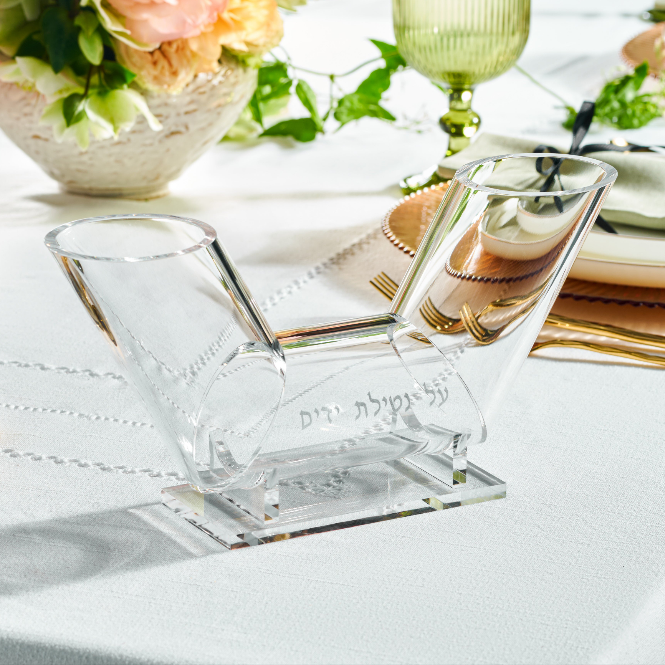 Clear lucite dual spout washing cup on a table setting with flowers and cutlery - Zstander