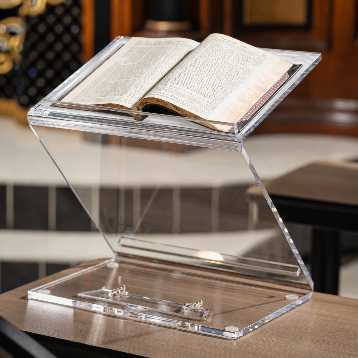 Pearl marble sit & stand shtender with a sefer open in a shul