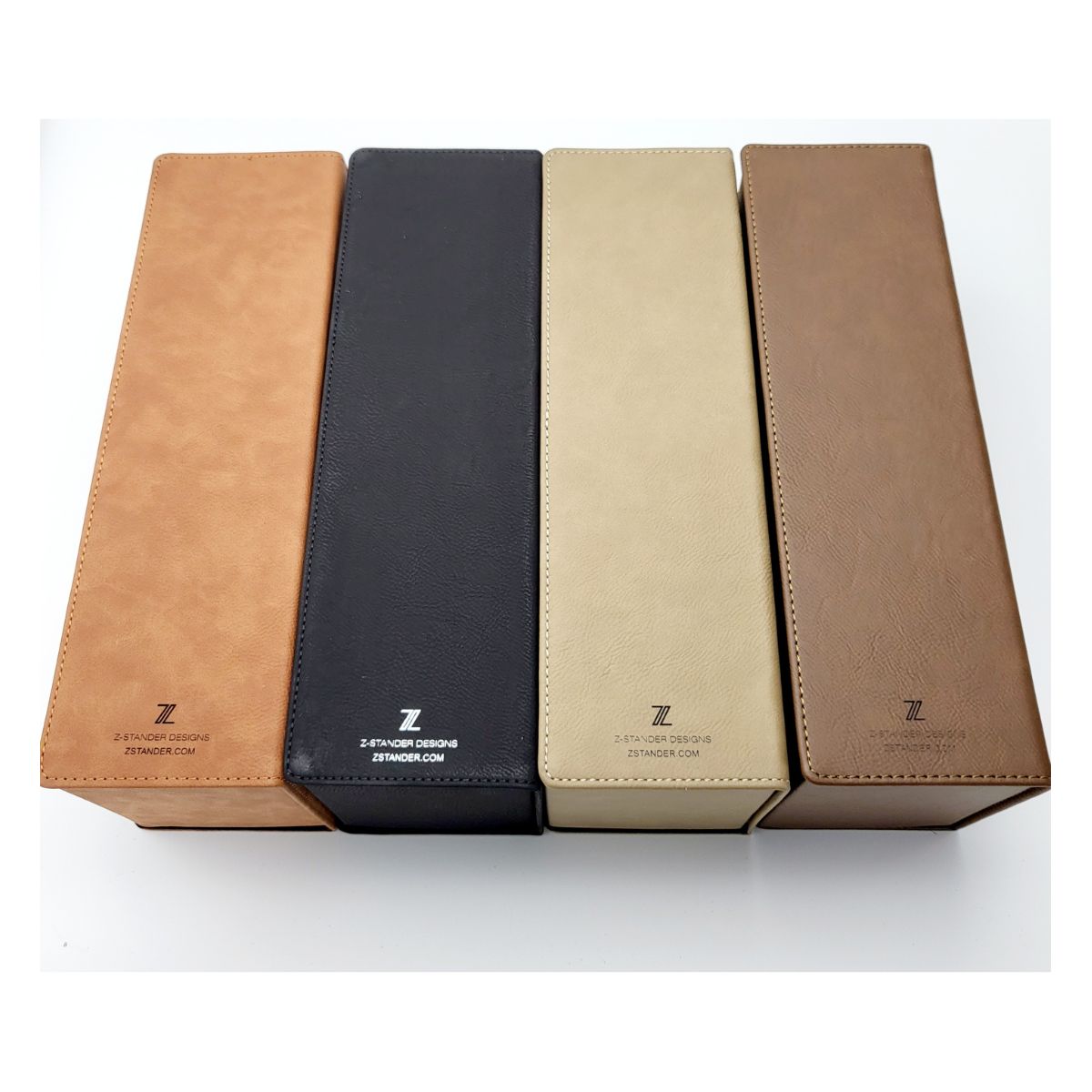 Four leather-bound boxes with a brand logo on a white background