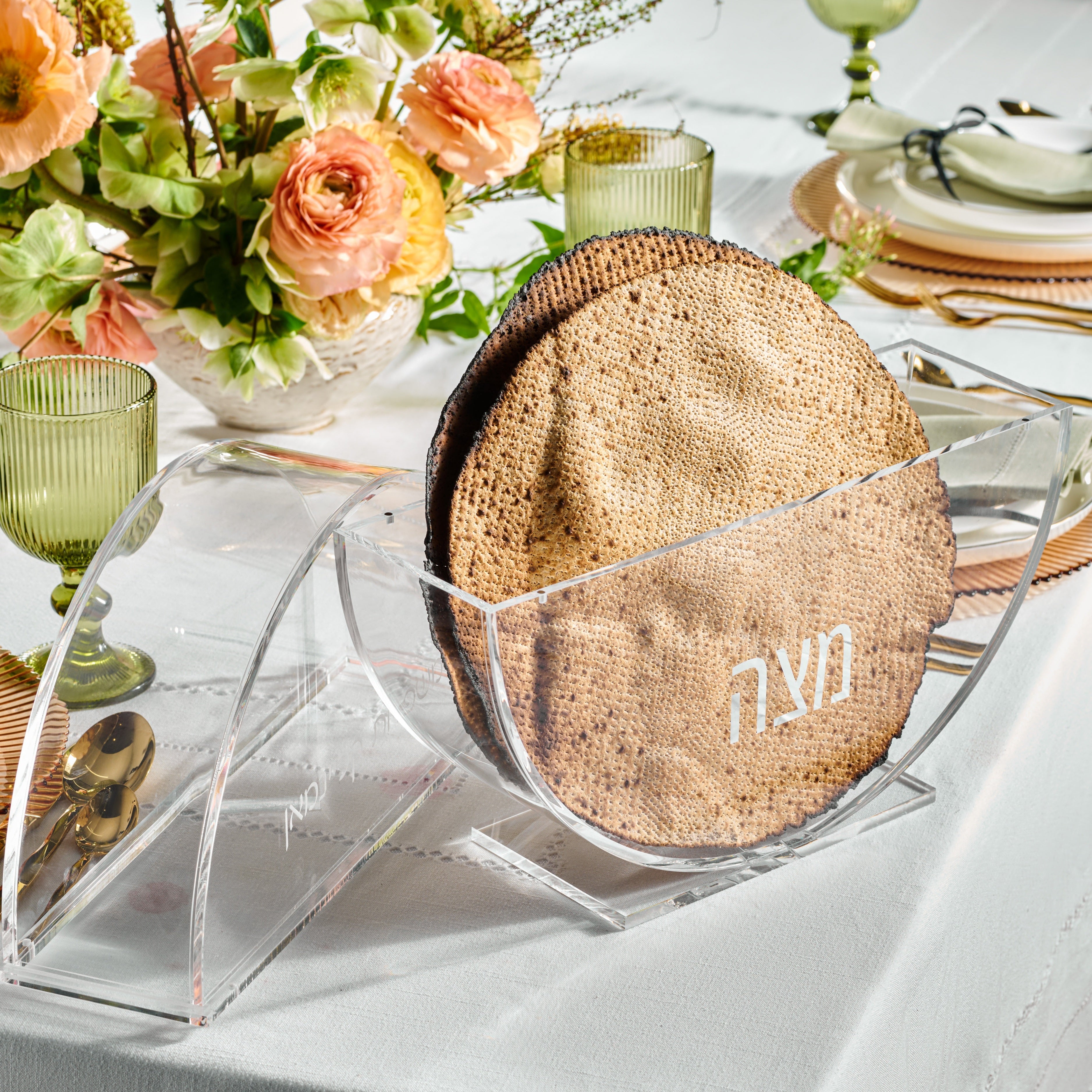 Open round standing matzah box on a set passover seder table - Zstander