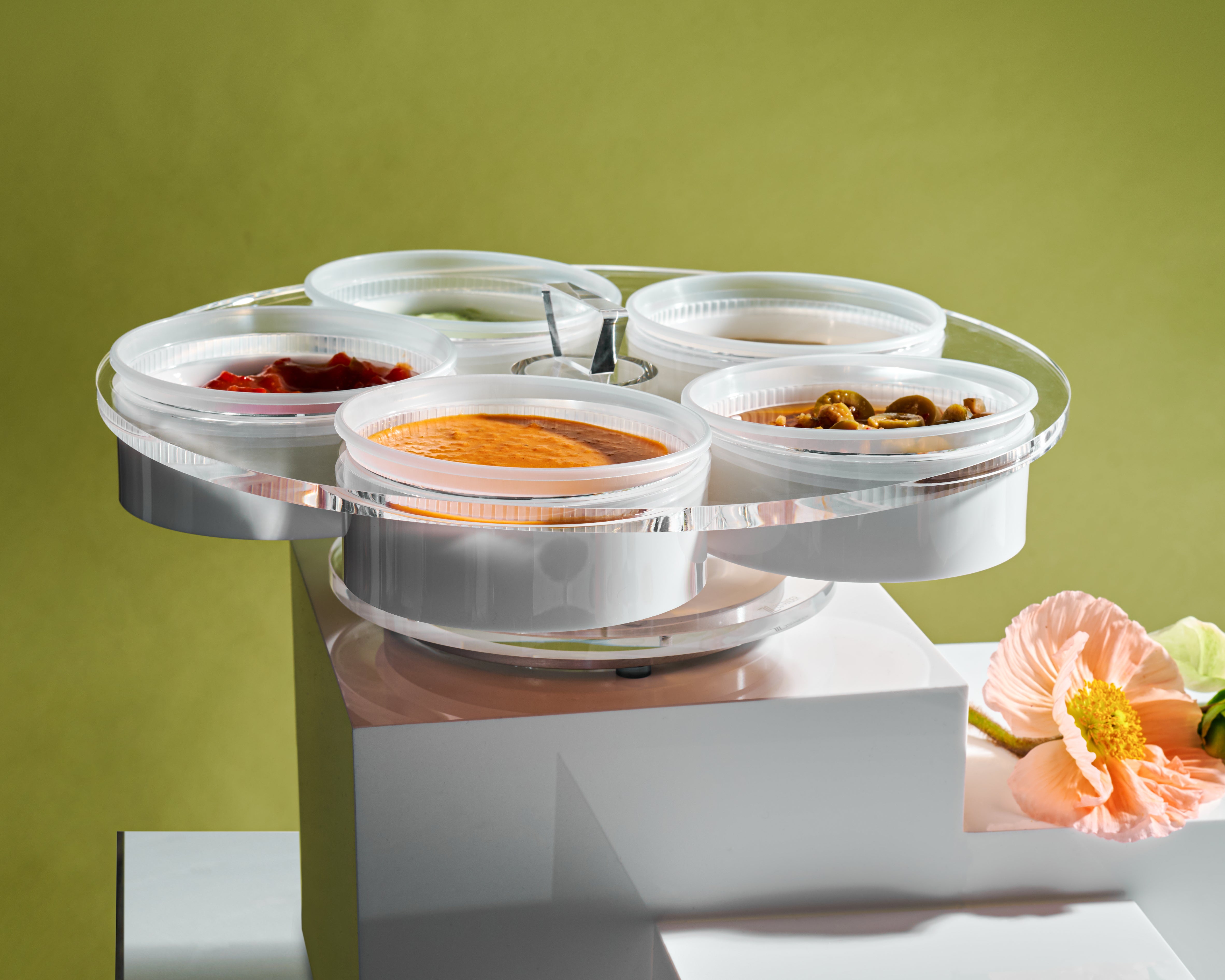 Lazy Suzan round dip tray on pedestals with a green background - Zstander