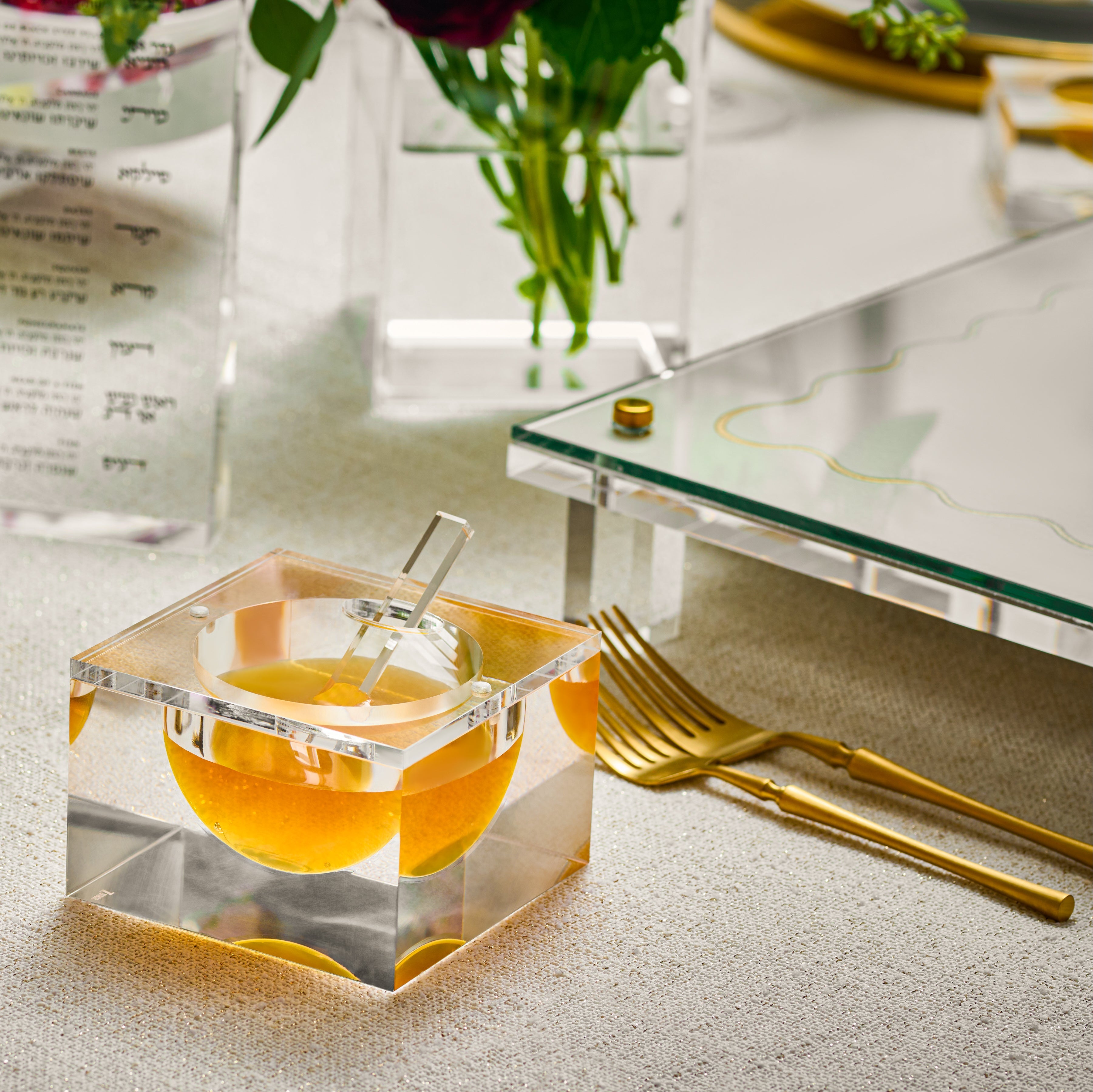Dining table setting with crystal salt dish, gold cutlery, and red flowers - Zstander