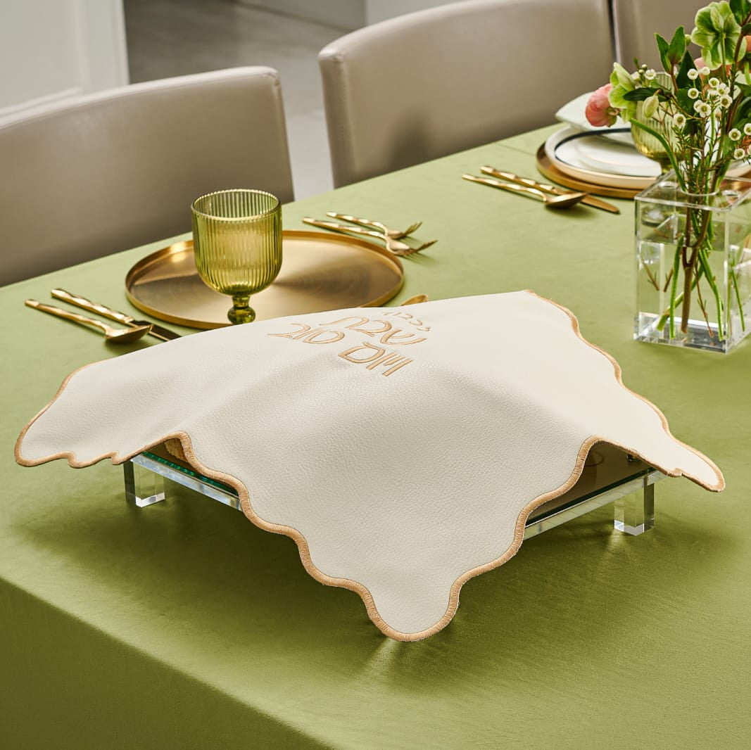 Dining table set with green tablecloth, gold cutlery, and decorative elements - Zstander