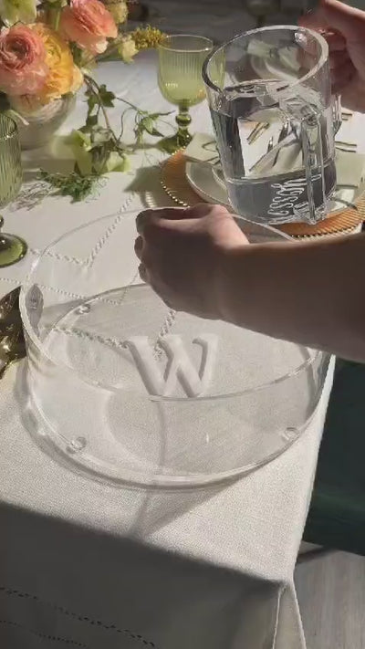 pouring water with a clear lucite washing cup