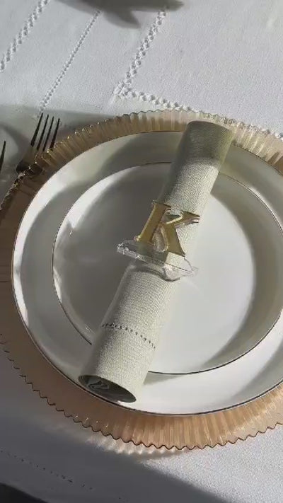 Monogrammed K napkin ring on a plate