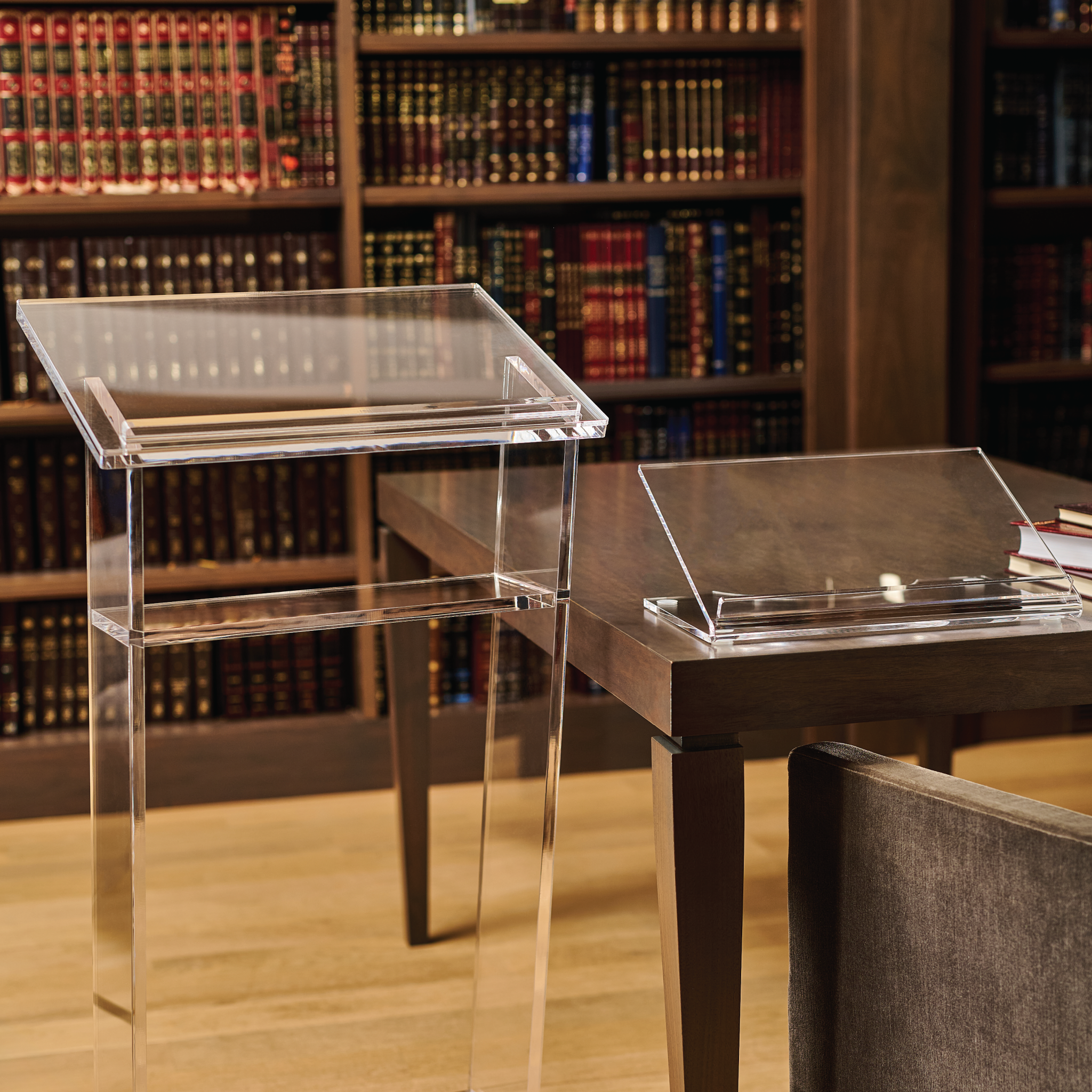 Clear acrylic shtender on a dark wood base in a library setting - Zstander