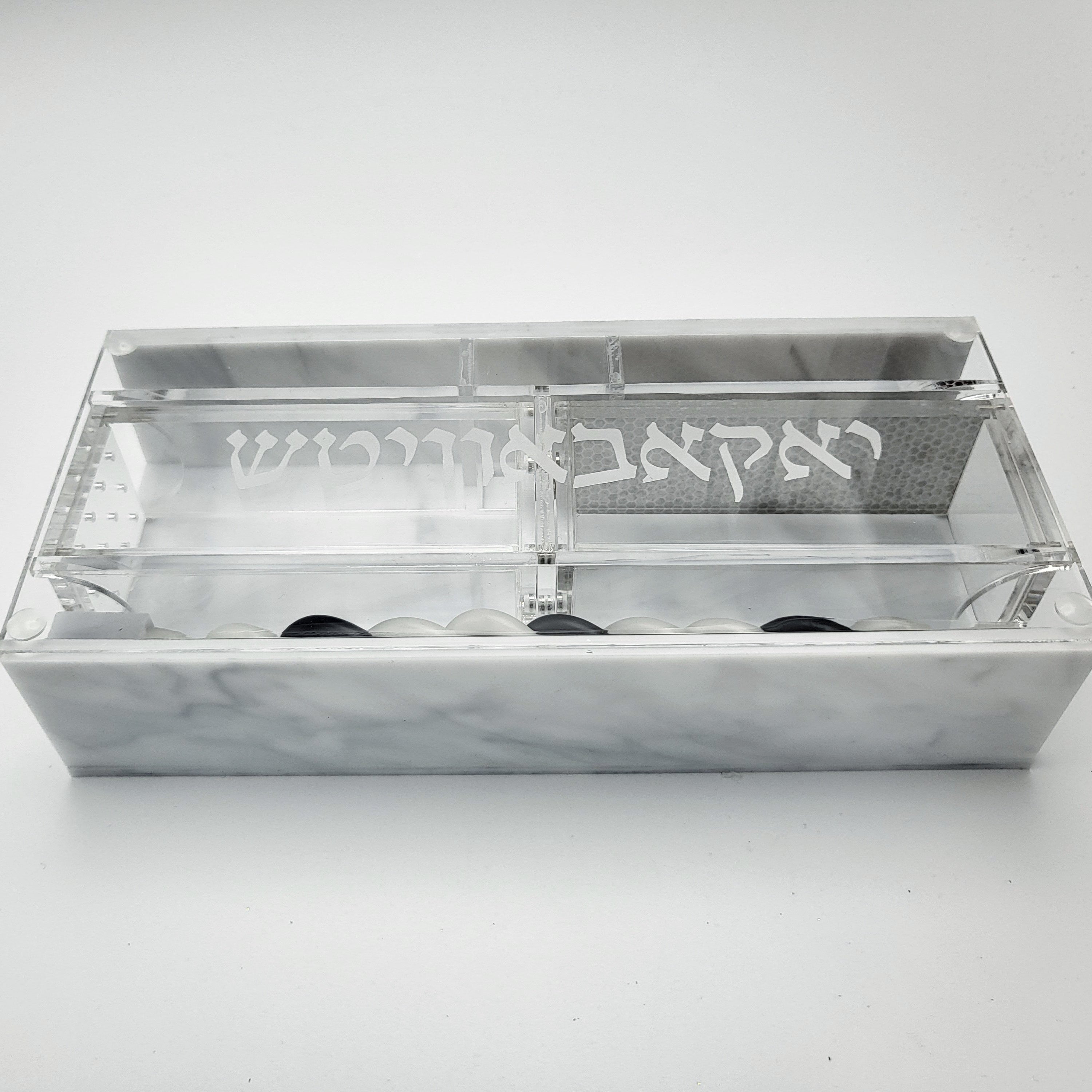 Zstander Havdalah set engraved with a name in hebrew on a white background. 