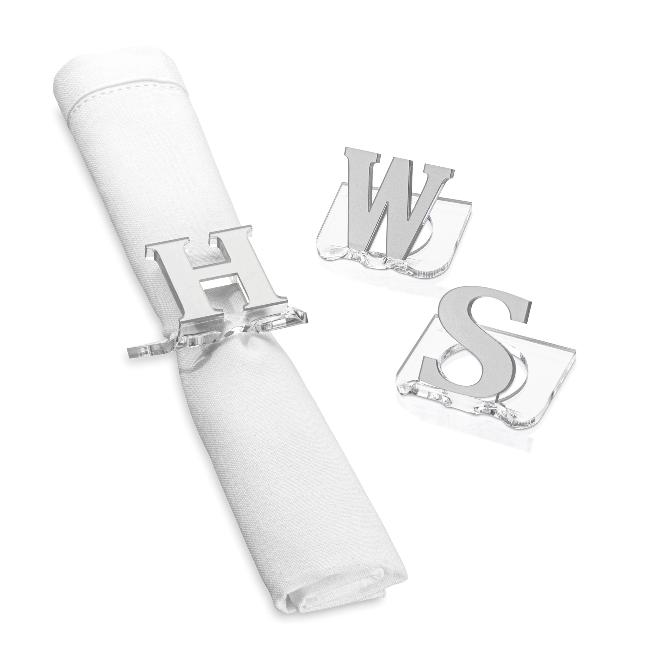 A clear lucite napkin ring with a monogrammed letter 'S', ", 'W' H' in silver - Zstander
