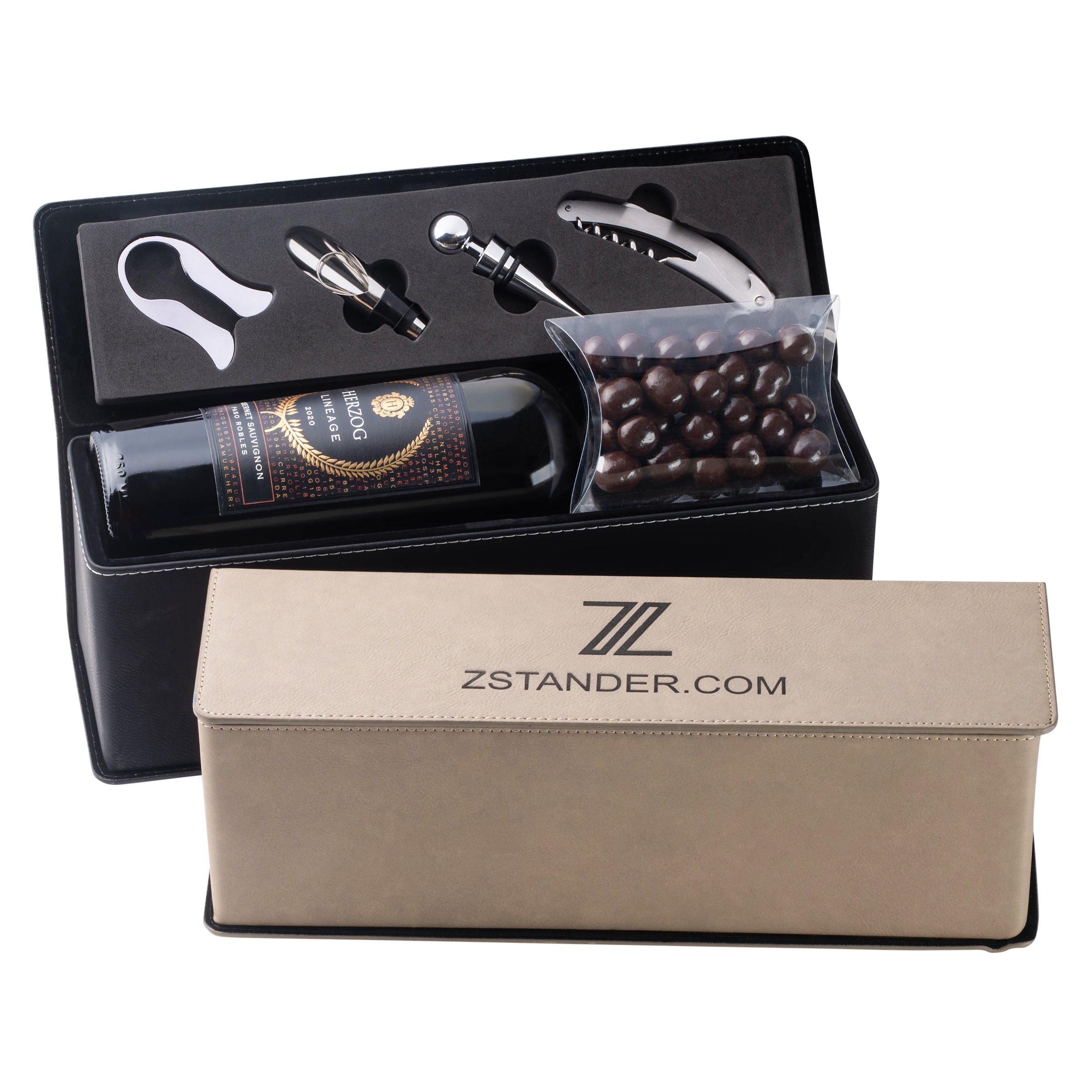 A leatherette wine box set with accessories including a corkscrew, bottle stopper, aerator, and foil cutter displayed inside the box, with a beige box lid showing the brand name 'ZSTANDER.COM'.